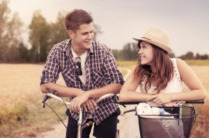 Portrait of happy couple on bicycles
